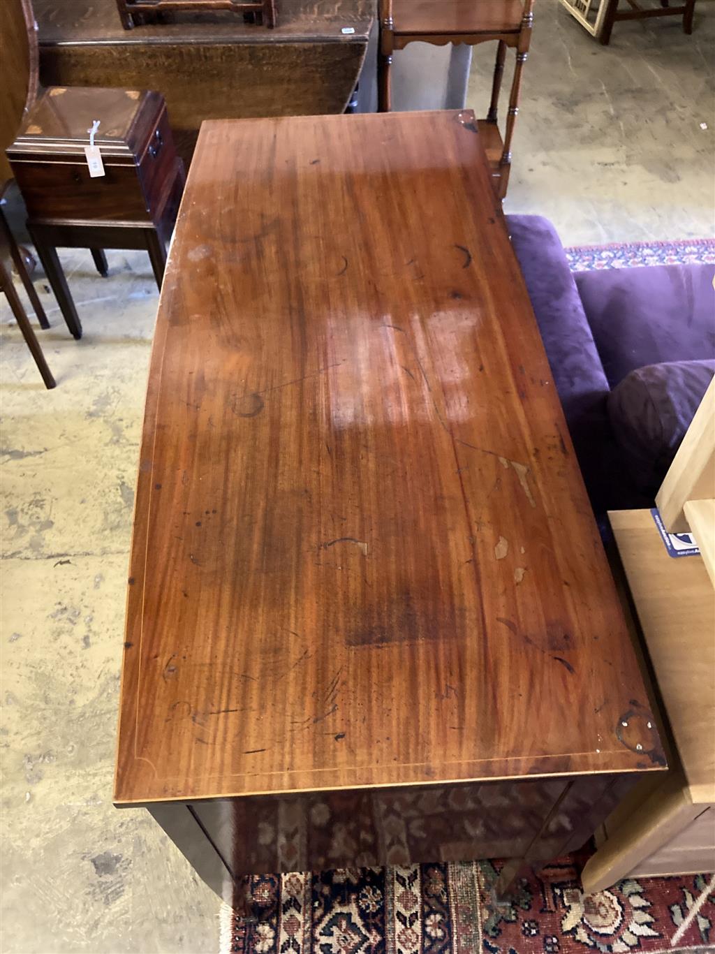 An Edwardian mahogany bow fronted sideboard, length 137cm, depth 60cm, height 91cm